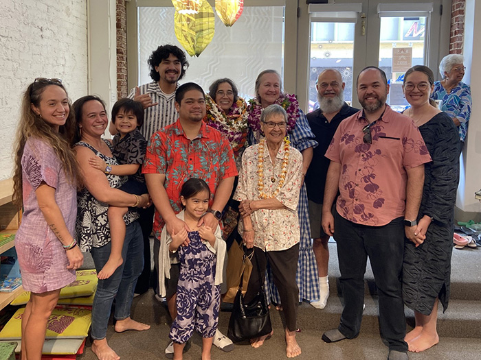 Kamalaniʻs family with the shopʻs Kūakoloa Robinson (striped shirt)